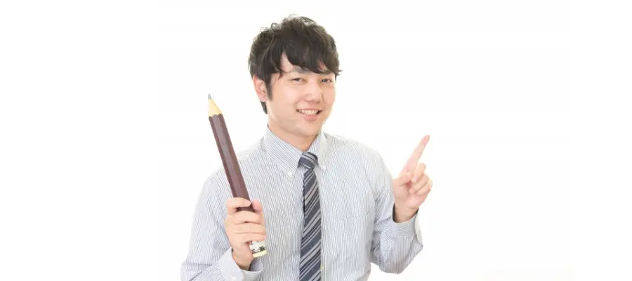 鉛筆を持っている男性の画像